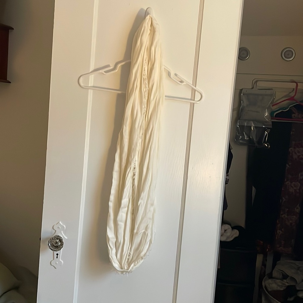 Excellent condition cream colored infinity scarf.